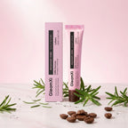GleamXi Rosemary Foliu Scalp Serum in a pink squeeze tube next to its matching pink box, styled with rosemary sprigs and coffee beans on a white marble surface against a soft pink background.